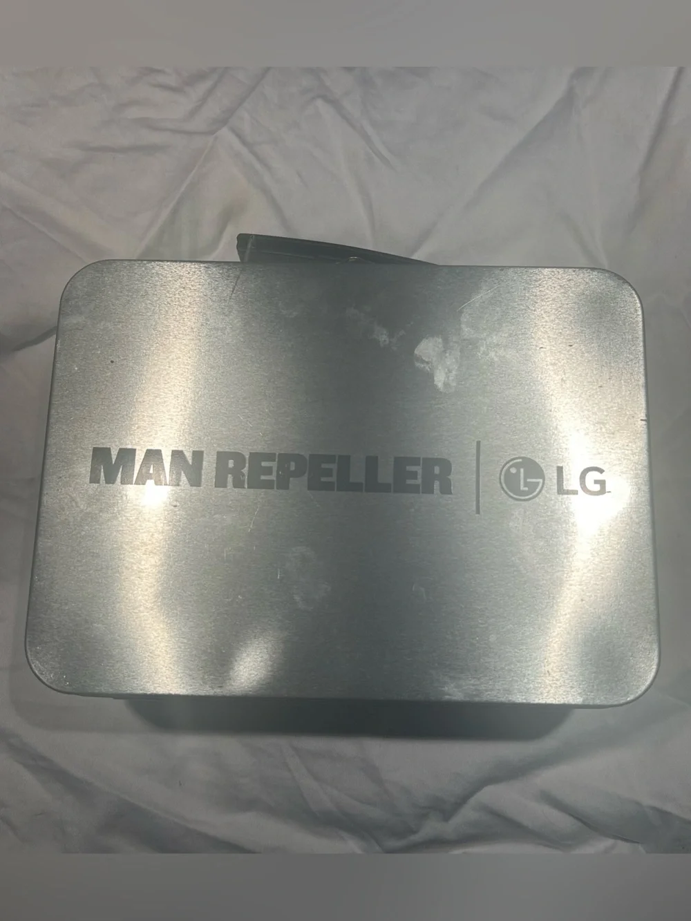 MAN REPELLER x LG tin lunchbox